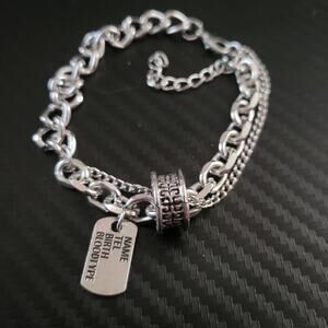 Chunky layered silver tone chain bracelet with dog tag charm